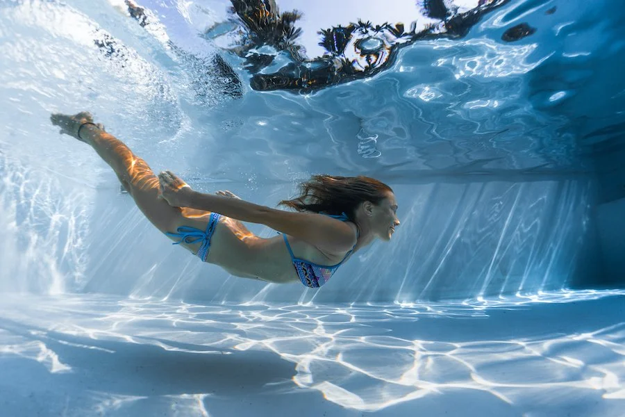 A view from the water of a woman swimming